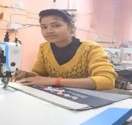 a girl stitching wearing yellow sweater